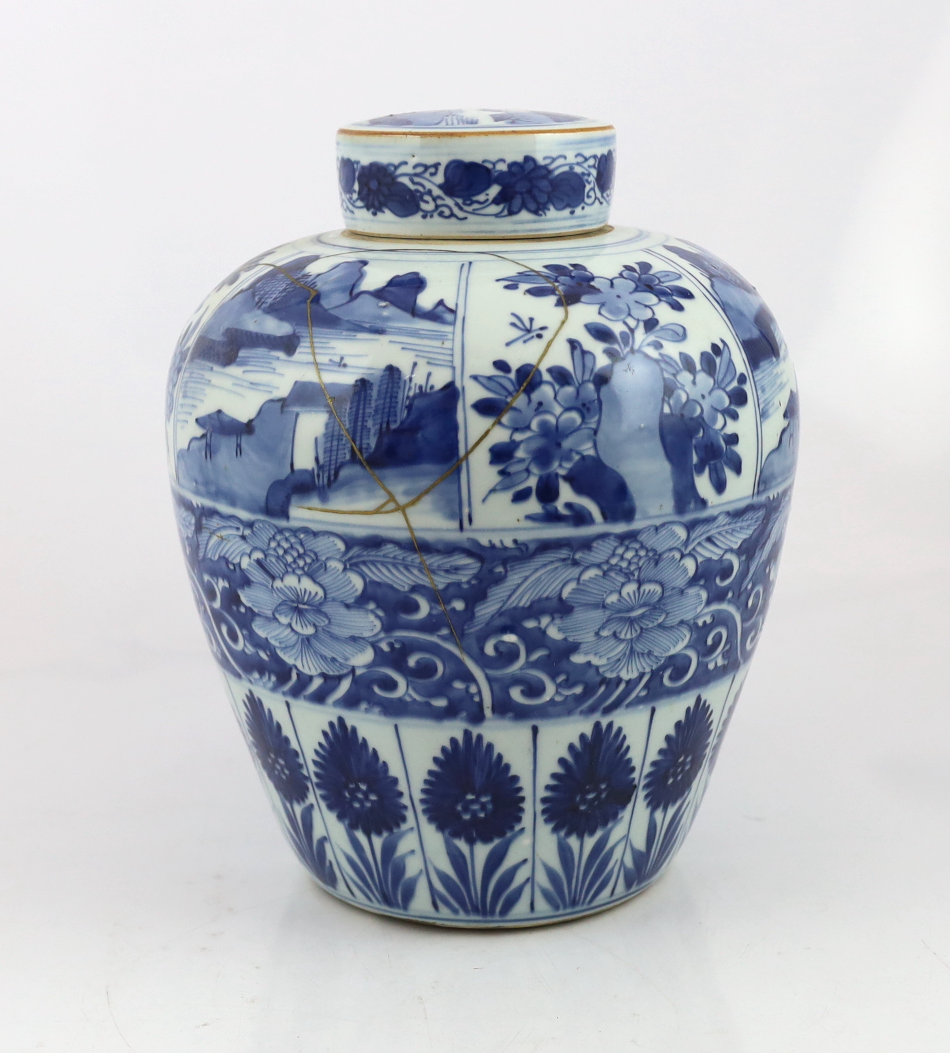 A Chinese blue and white ovoid jar and cover, Kangxi period, broken with kintsugi repair